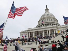 Man Videod Throwing Fire Extinguisher at Police Officer during the Capitol Riot Arrested