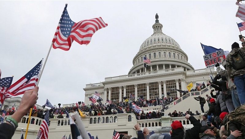 Man Videod Throwing Fire Extinguisher at Police Officer during the Capitol Riot Arrested